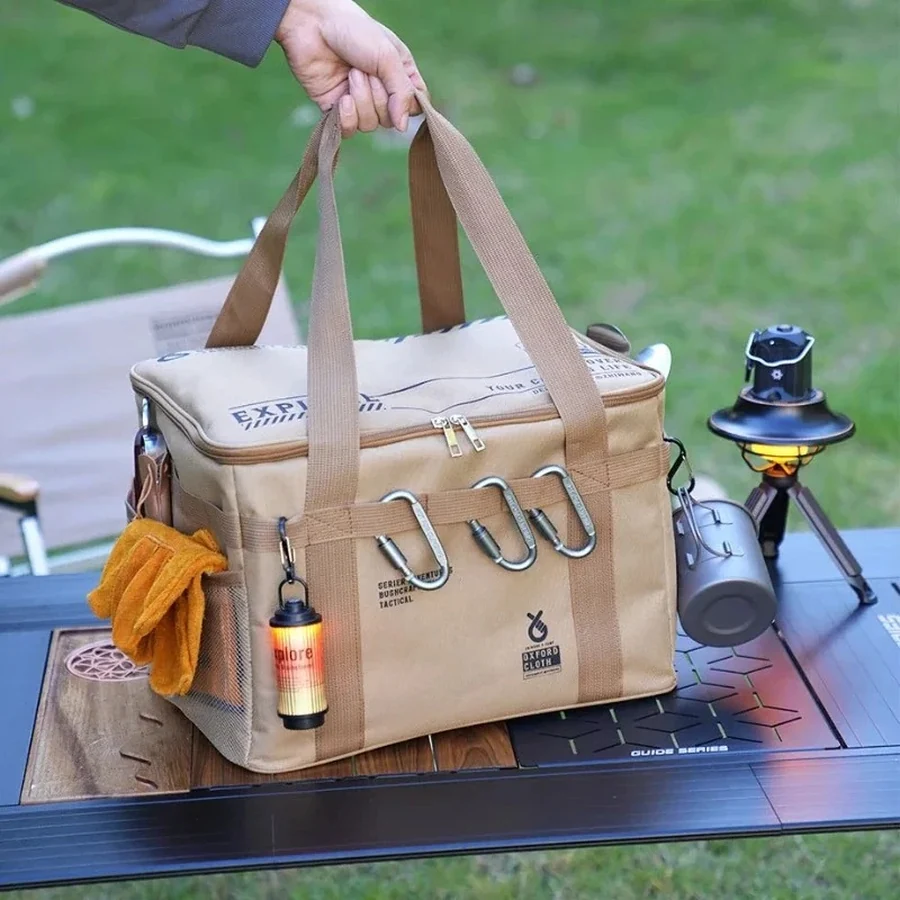 Camp kitchen storage bag carried by its handles